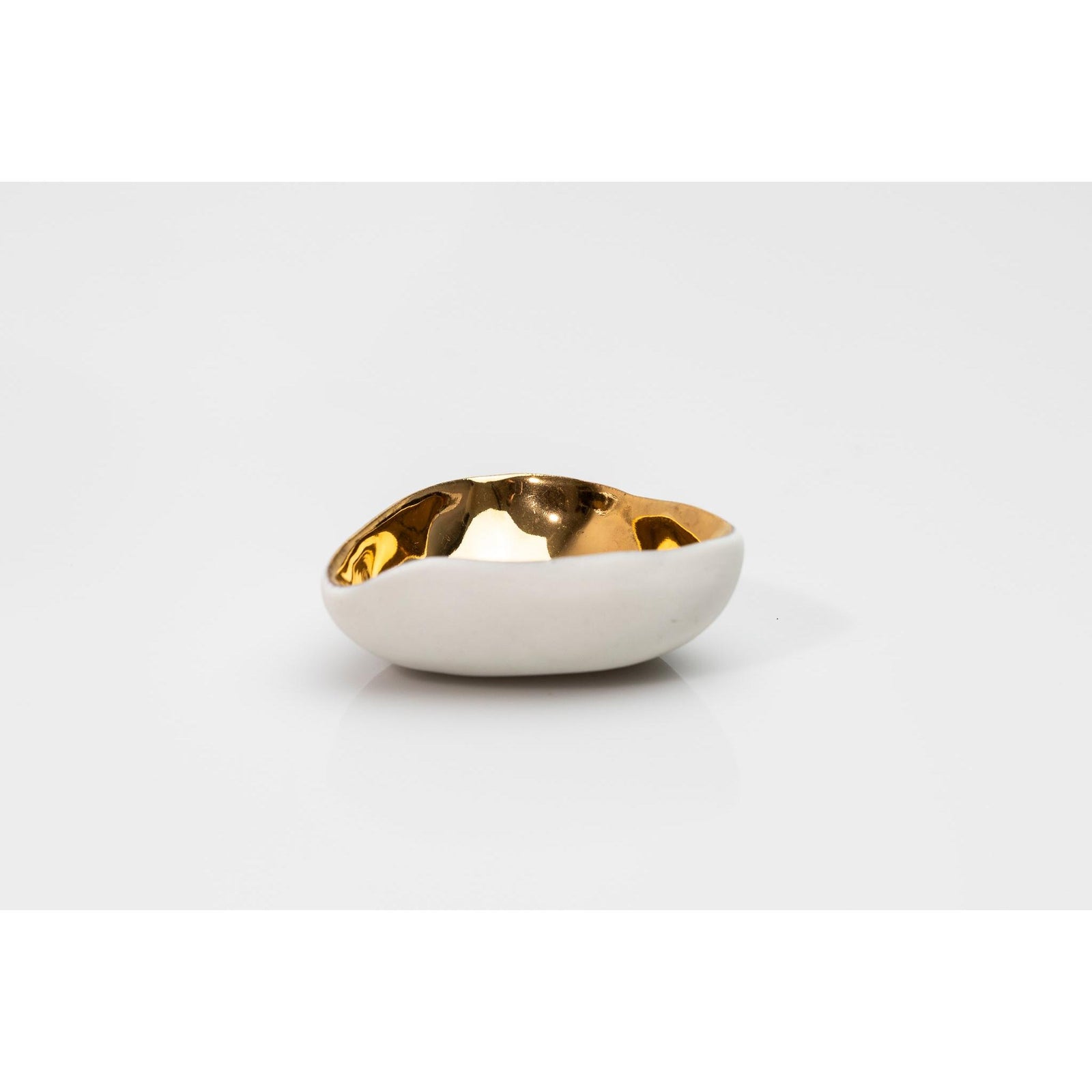 PL08 Shallow Three Sided Bowl, white porcelain and gold lustre by Penny Little. Available at Padstow Gallery, Cornwall