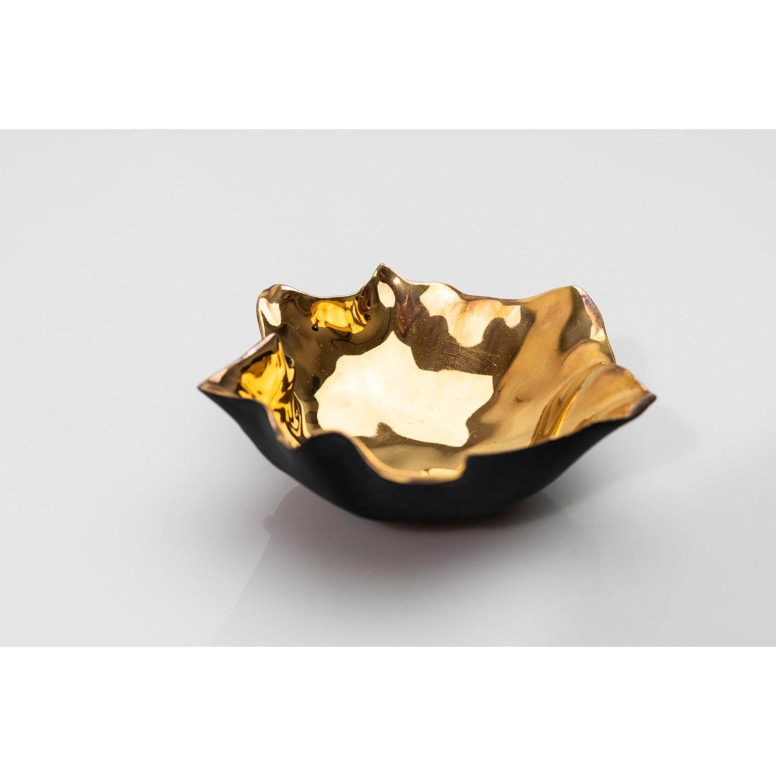 PL05 Open Form, black porcelain and gold lustre by Penny Little. Available at Padstow Gallery, Cornwall