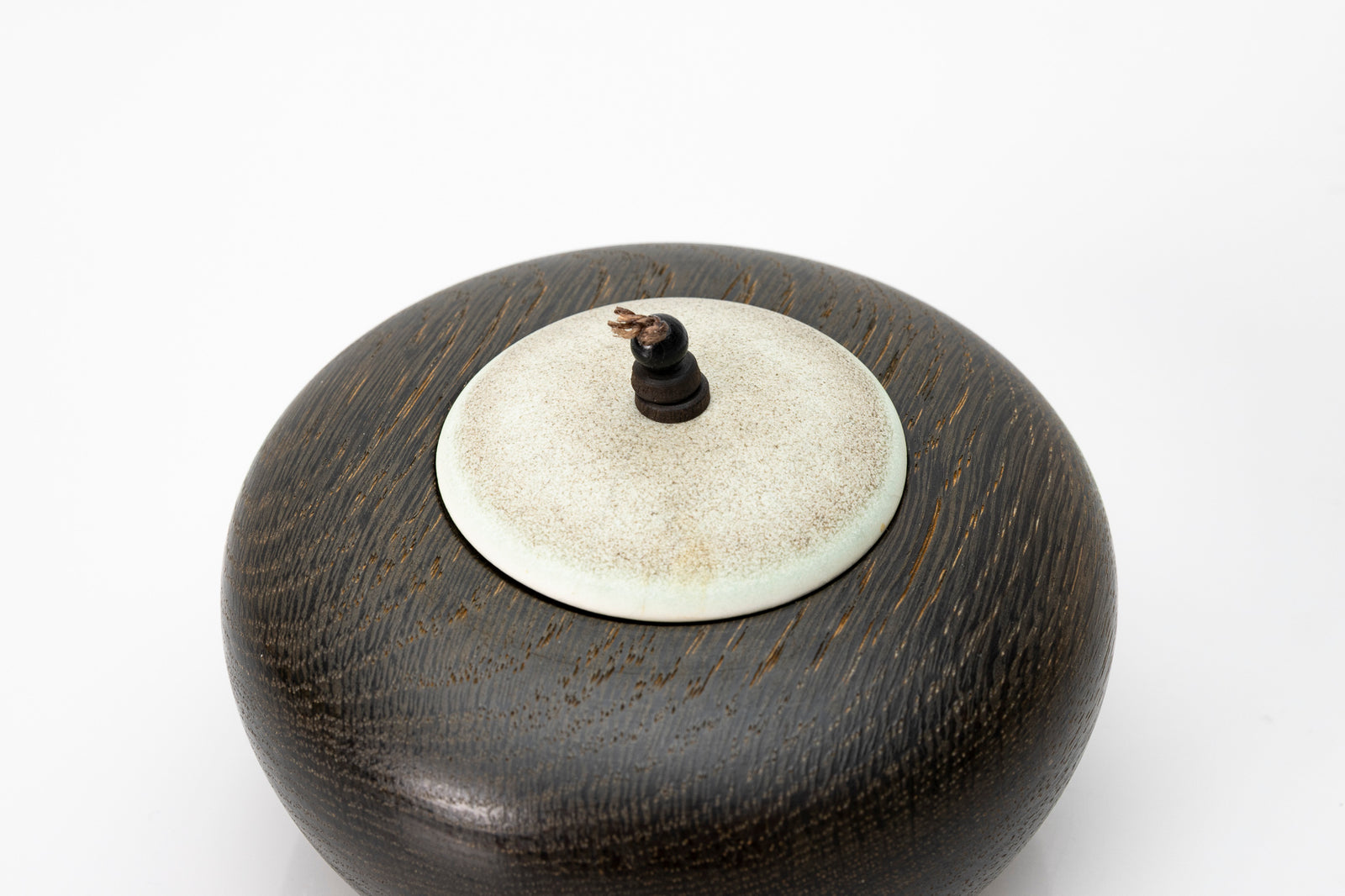 Ebonised oak pebble pot by Kate Schuricht ceramics, available at Padstow Gallery Cornwall