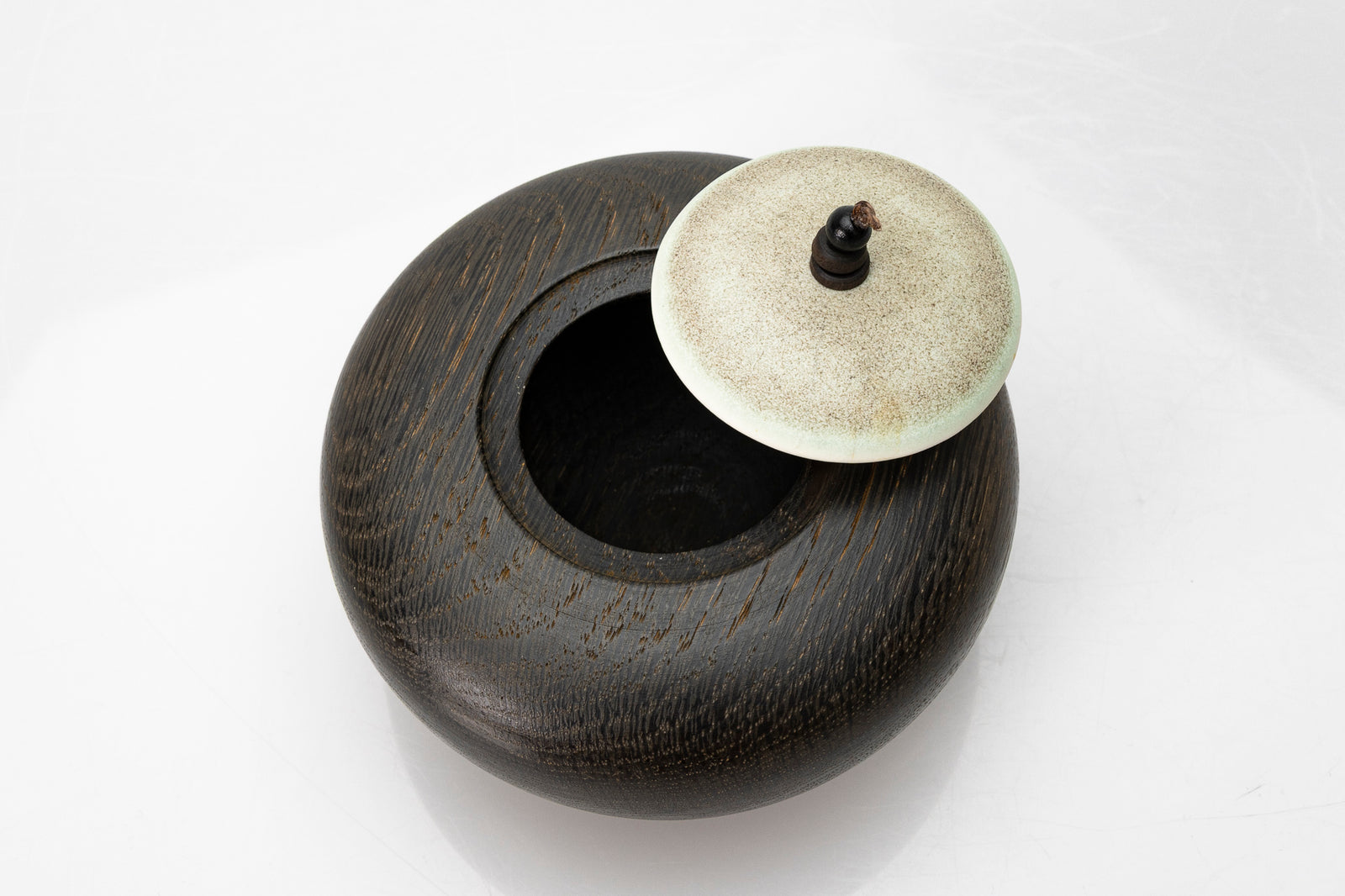 Ebonised oak pebble pot by Kate Schuricht ceramics, available at Padstow Gallery Cornwall