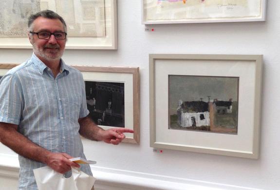 David Pearce fine artist, next to his instantly recogniseable primitive style original work