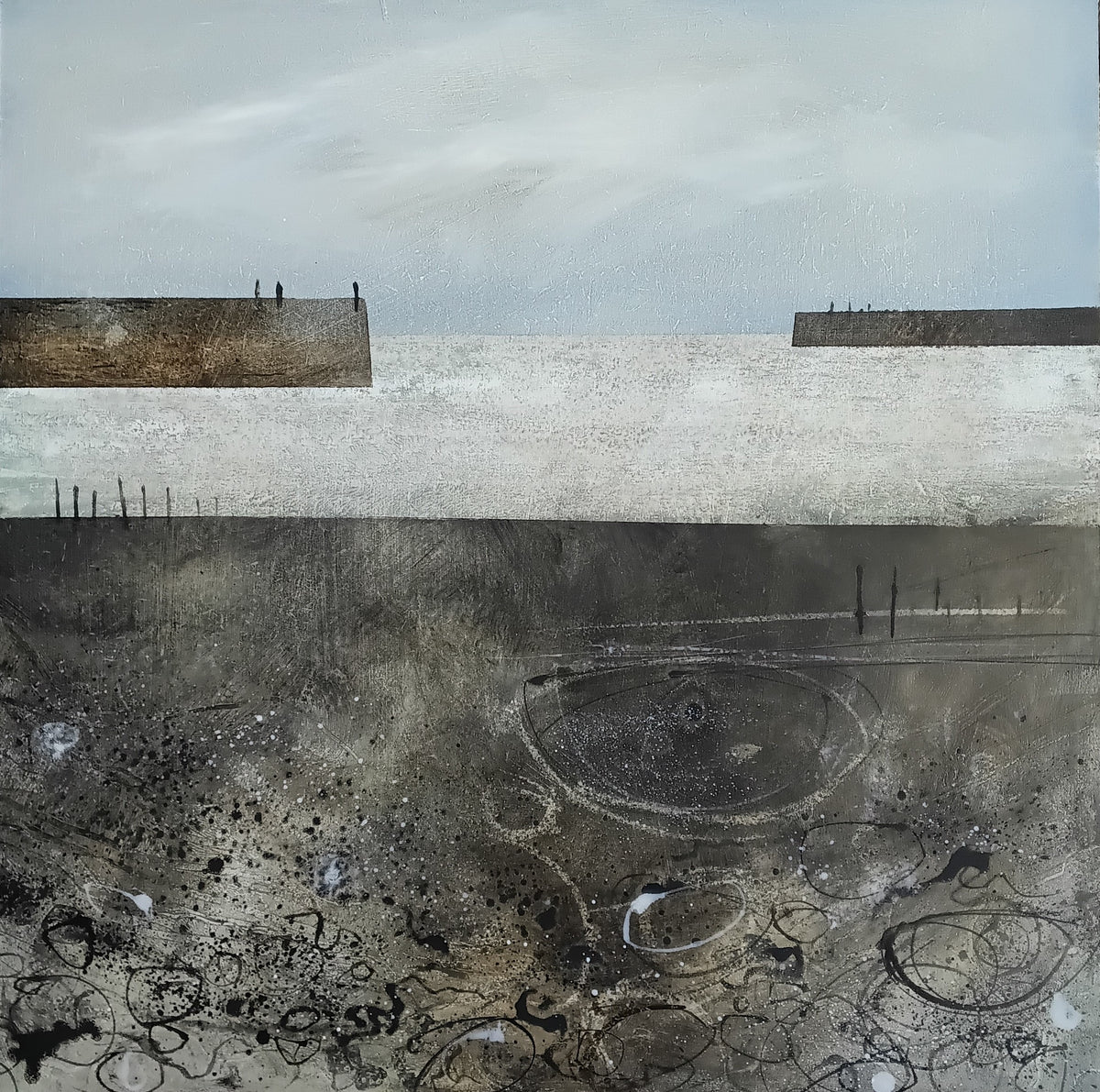 An abstract landscape painting featuring a pale gray sky, a wide light band, dark charcoal ground with circular and scribbled marks, and two low rectangular landforms with tiny human figures standing on them.