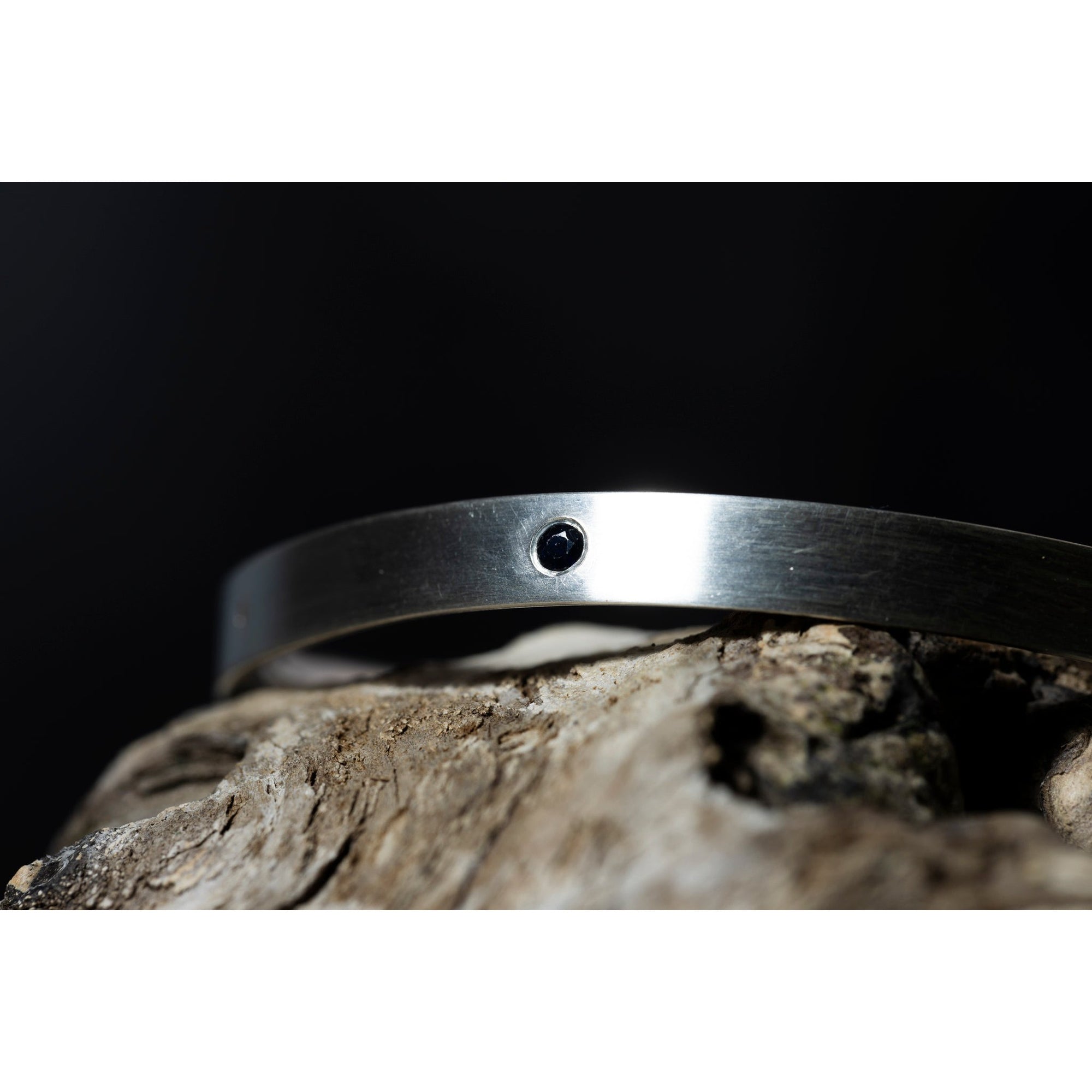 'SA B26 D-Shape Bangle with Sapphires' by Sandra Austin jewellery, available at Padstow Gallery, Cornwall