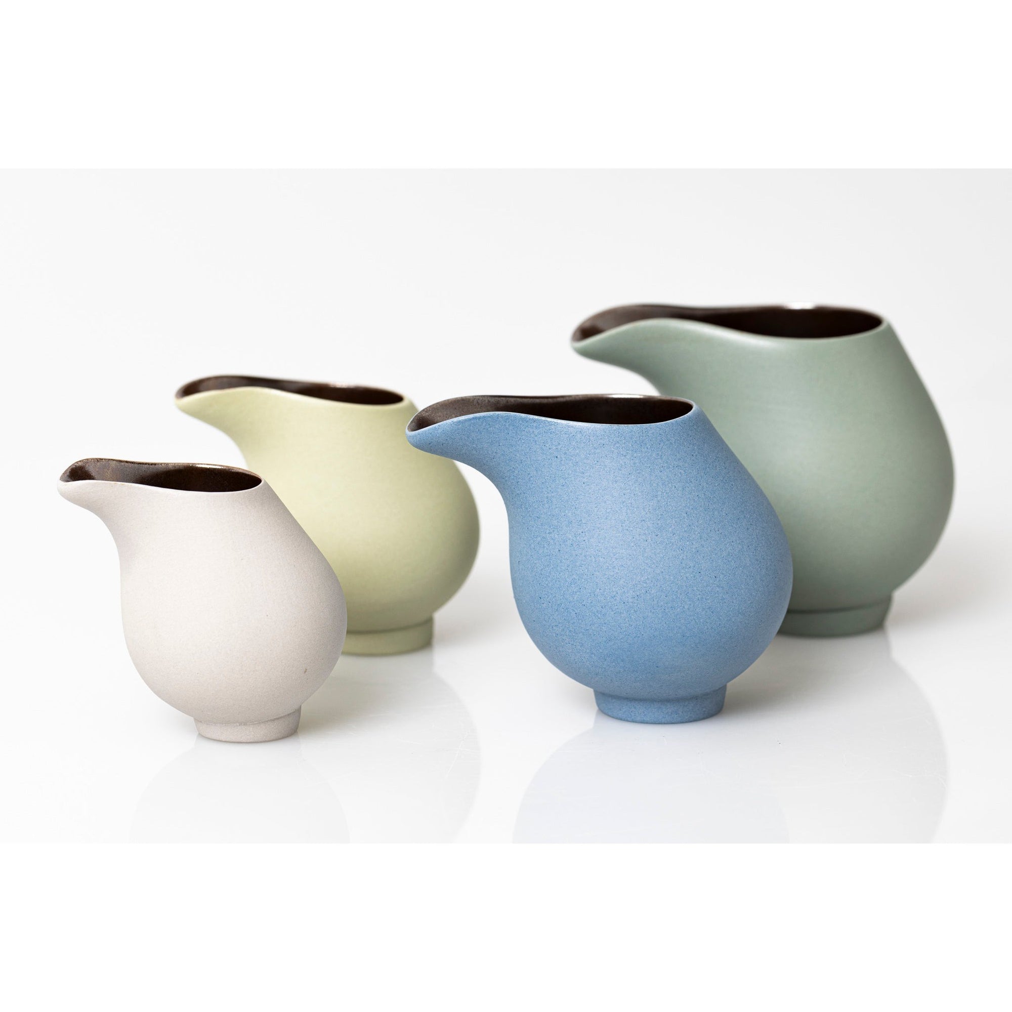 QQ3, QQ2, QQ1 and QQ4 Flow Lustre Stoneware Jug by Kate Schuricht ceramics available at Padstow Gallery, Cornwall