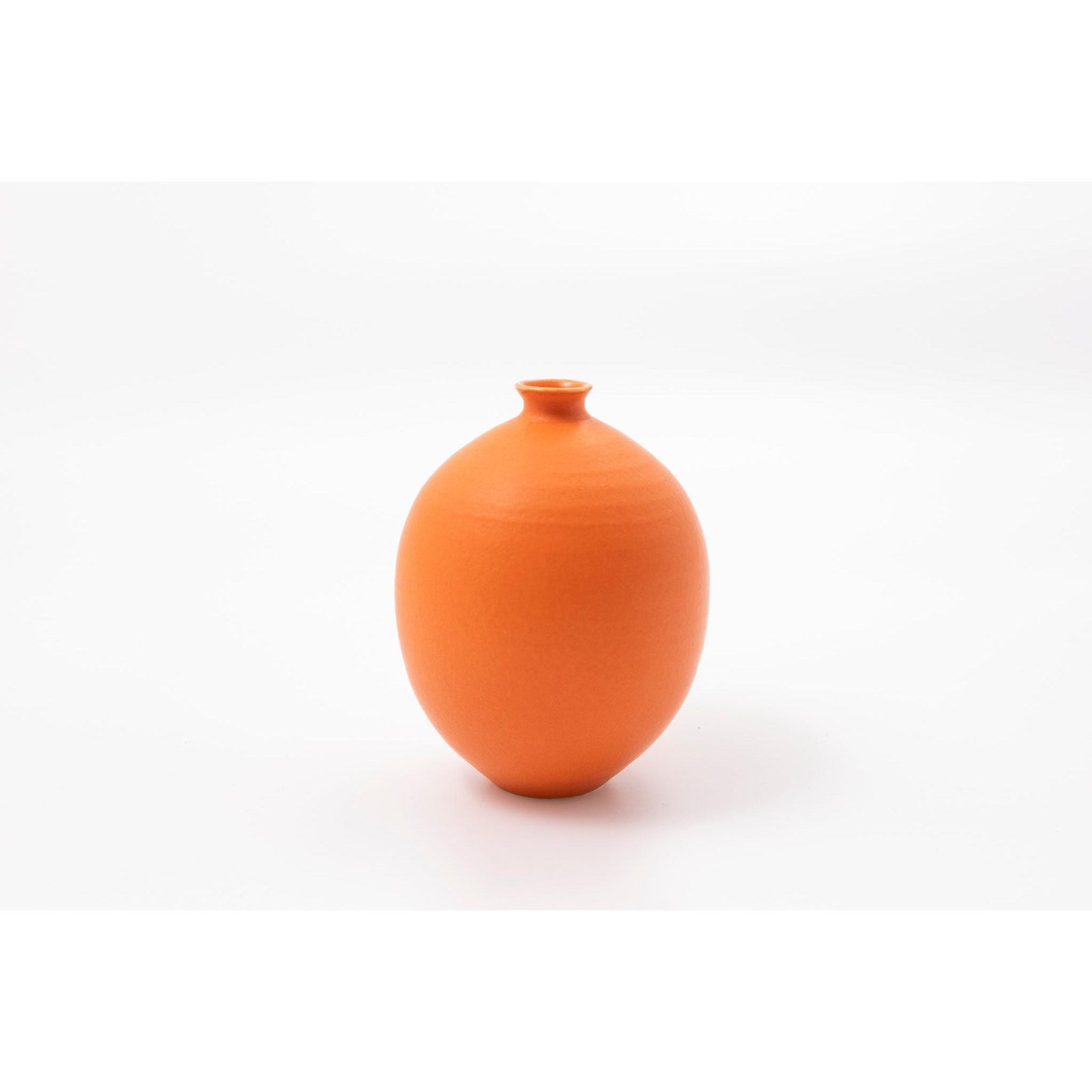 'LB207 Orange oval vase' by Lucy Burley ceramics, available at Padstow Gallery, Cornwall