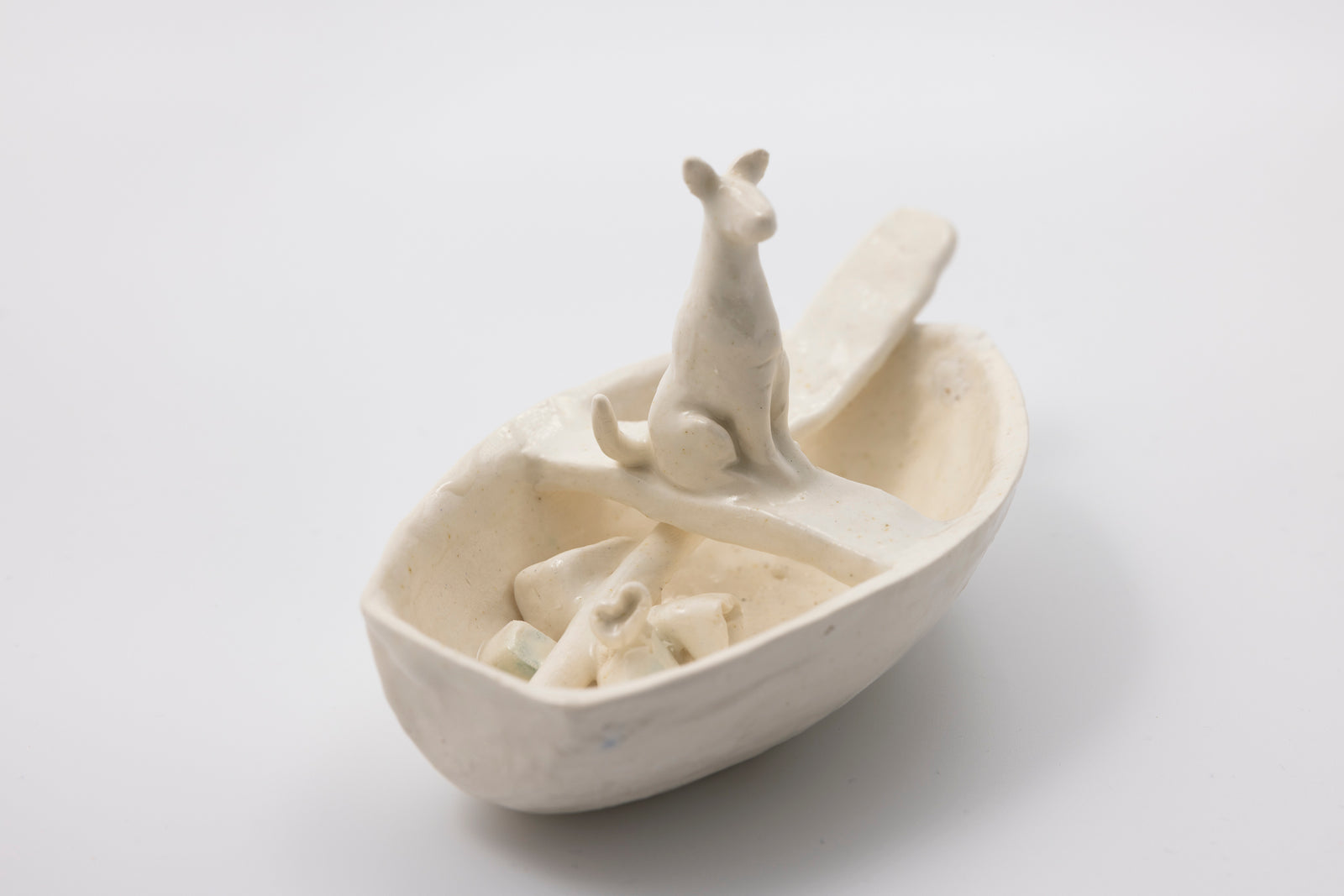 'White Dog in Boat (SH49)' Stoneware Boat by Sophie Howard, available from Padstow Gallery, Cornwall