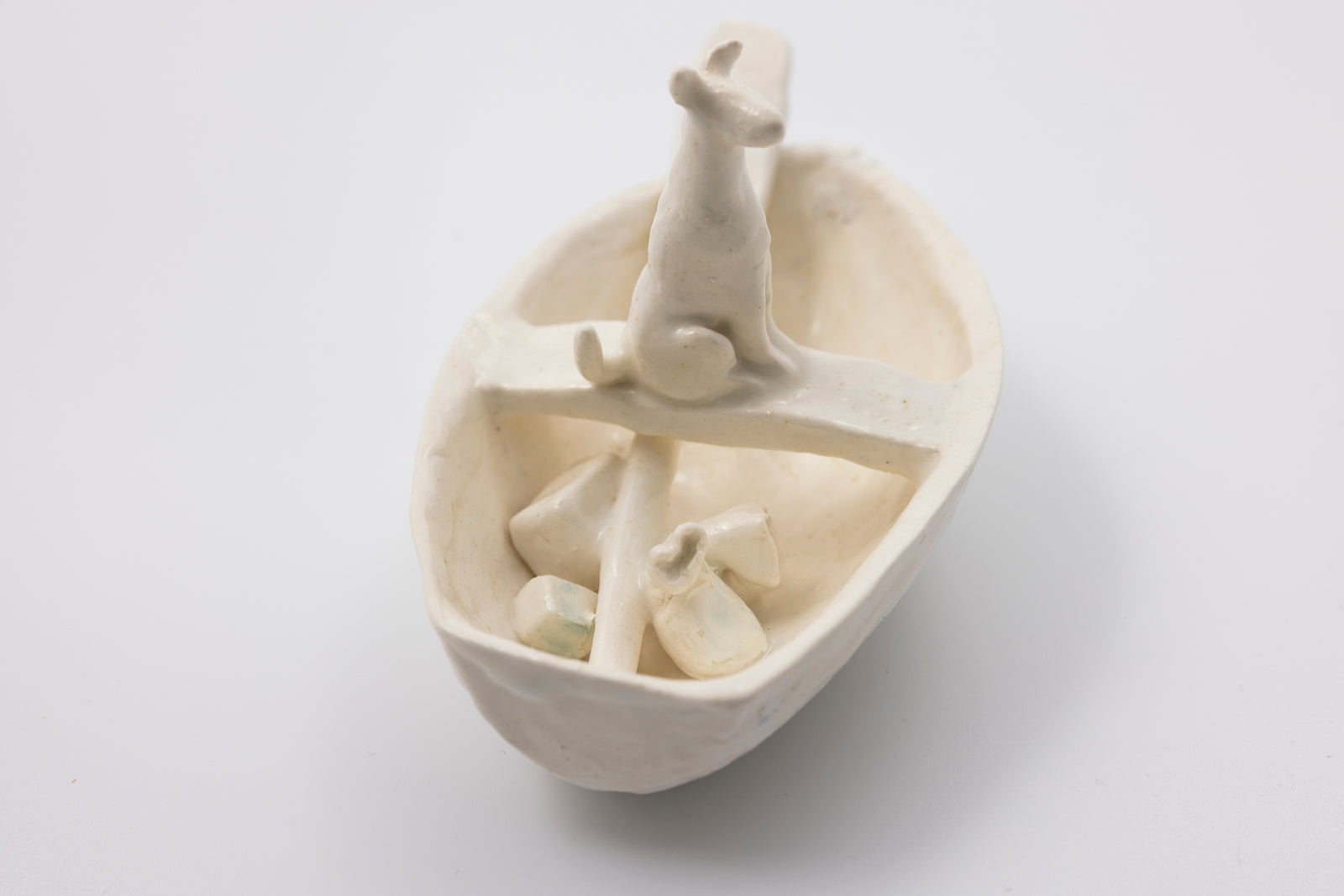 'White Dog in Boat (SH49)' Stoneware Boat by Sophie Howard, available from Padstow Gallery, Cornwall