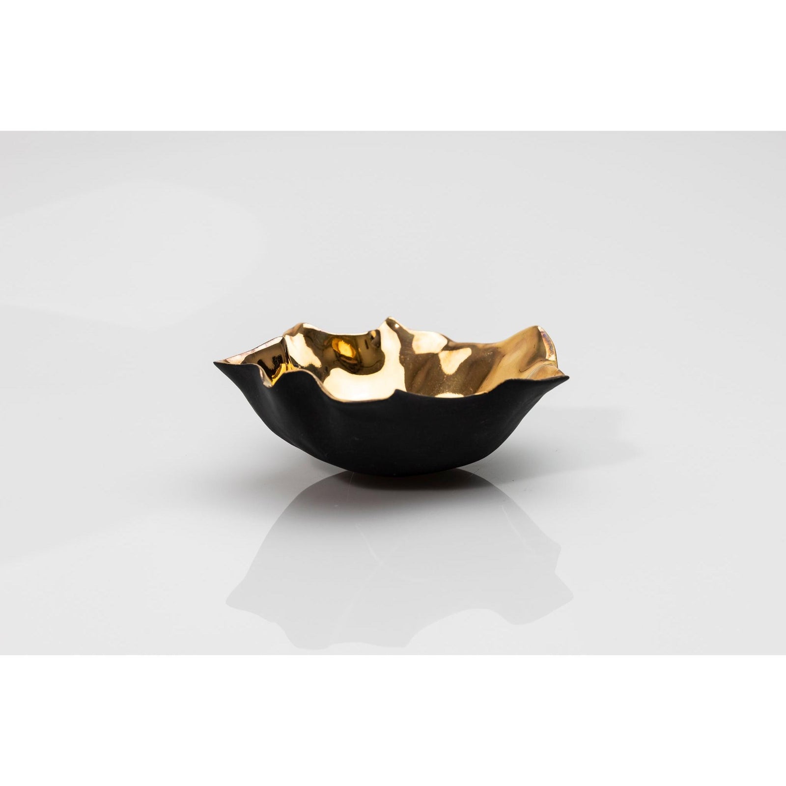 PL05 Open Form, black porcelain and gold lustre by Penny Little. Available at Padstow Gallery, Cornwall