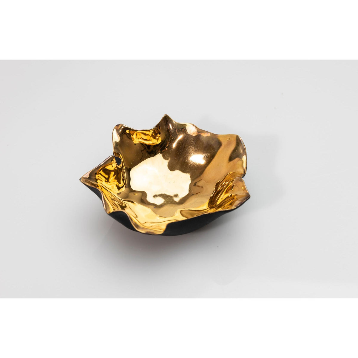 PL05 Open Form, black porcelain and gold lustre by Penny Little. Available at Padstow Gallery, Cornwall