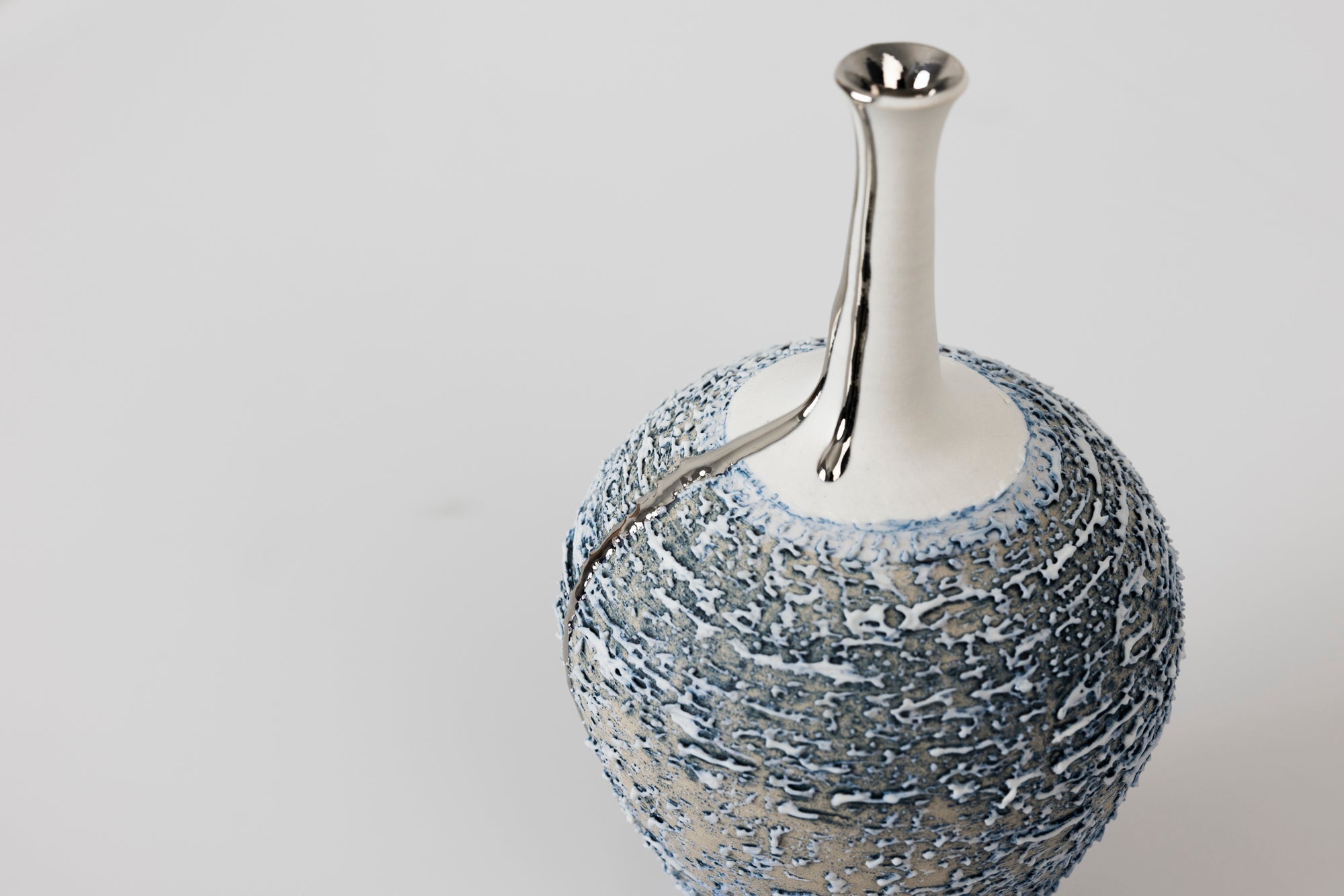 PGX39 Textured long necked vase with Platinum Lustre by Alex McCarthy available at Padstow Gallery