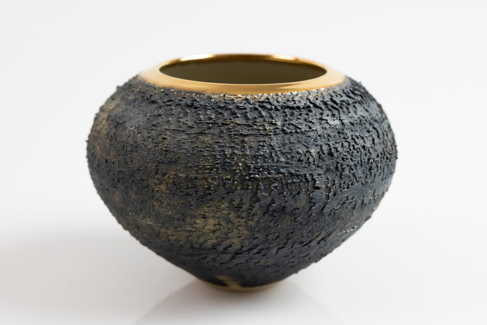 Textured vase with gold lustre rim, by Alex McCarthy, available at Padstow Gallery, Cornwall