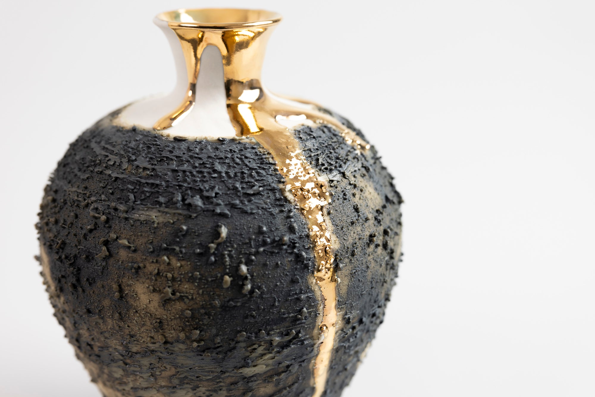 Textured vase with gold lustre, by Alex McCarthy, available at Padstow Gallery, Cornwall