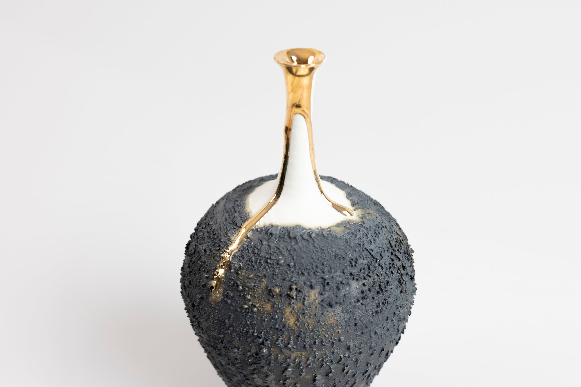 Textured long necked vase with gold lustre, by Alex McCarthy, available at Padstow Gallery, Cornwall