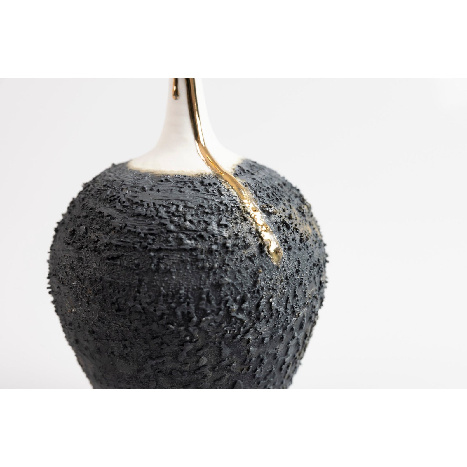 Textured long necked vase with gold lustre, by Alex McCarthy, available at Padstow Gallery, Cornwall