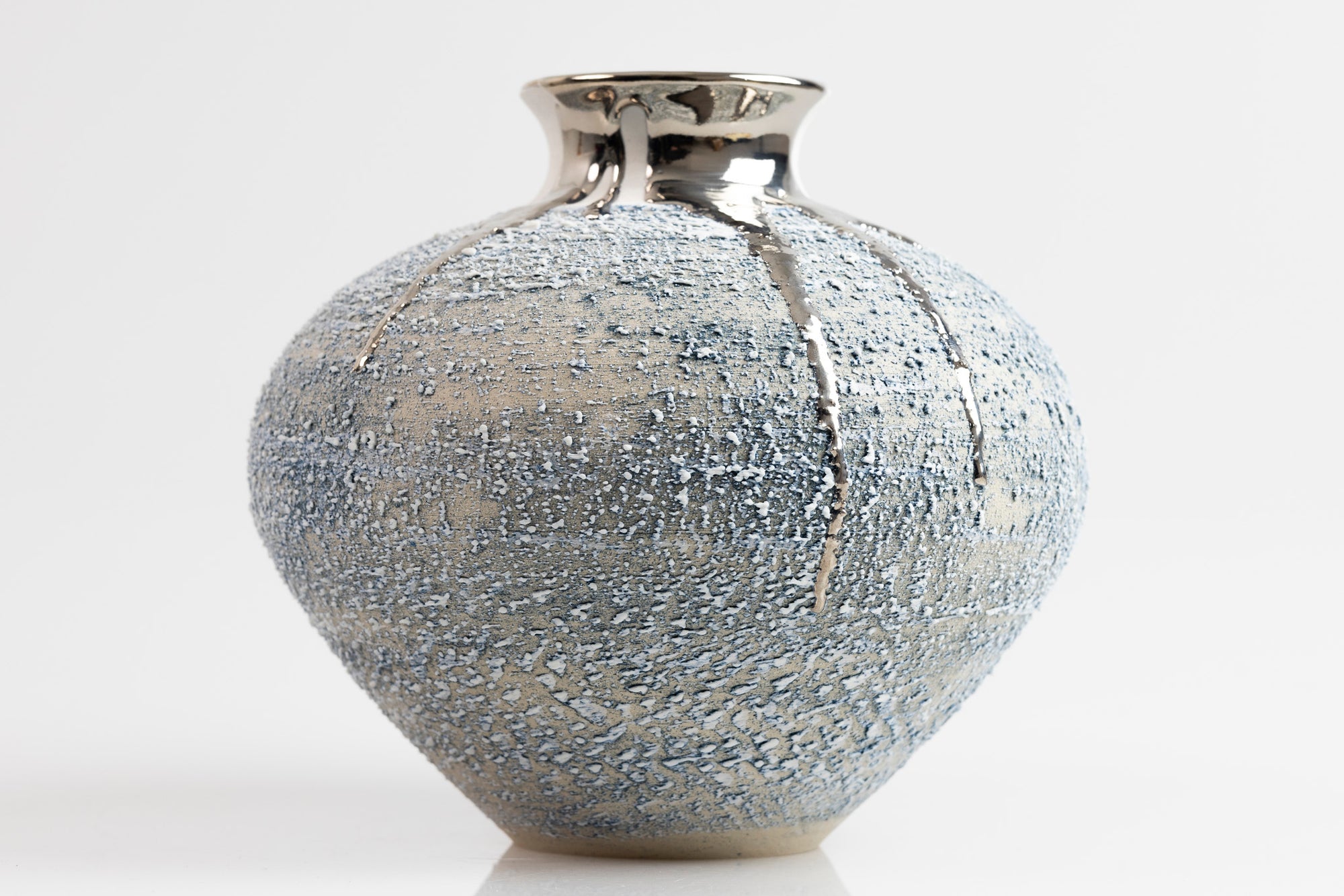 Textured vase with platinum lustre, by Alex McCarthy, available from Padstow Gallery, Cornwal