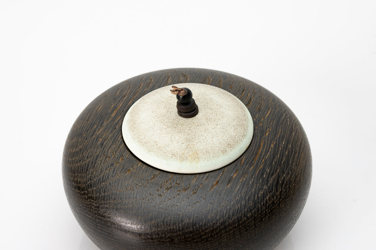 Ebonised oak pebble pot by Kate Schuricht ceramics, available at Padstow Gallery Cornwall