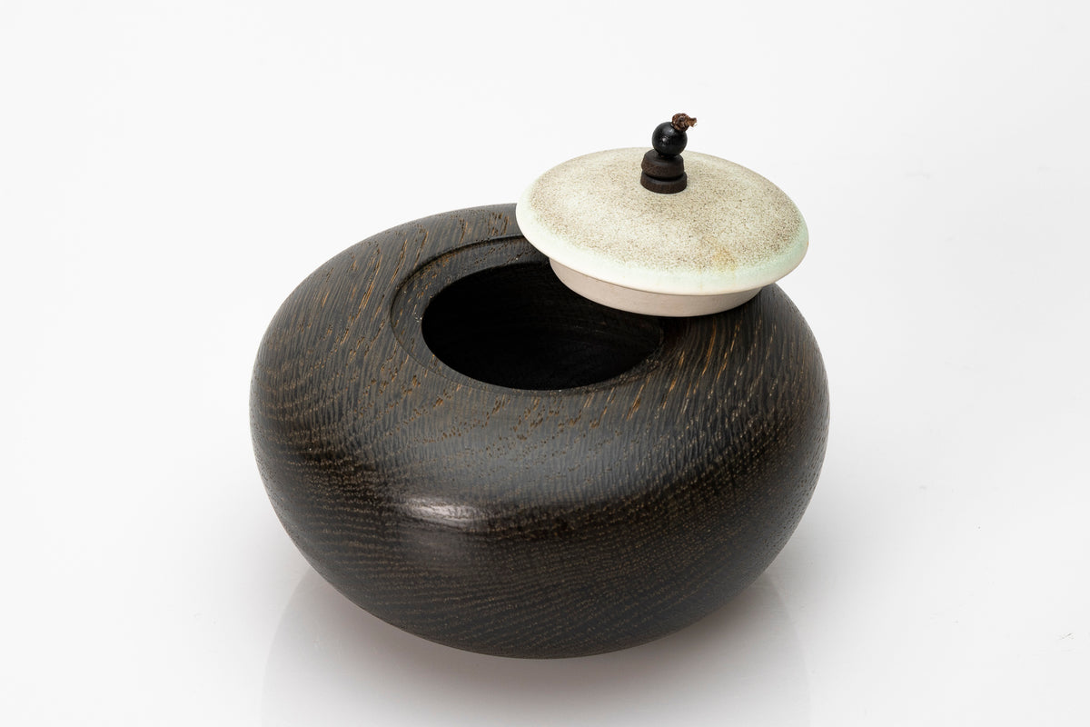 Ebonised oak pebble pot by Kate Schuricht ceramics, available at Padstow Gallery Cornwall