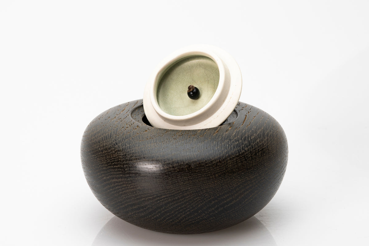 Ebonised oak pebble pot by Kate Schuricht ceramics, available at Padstow Gallery Cornwall