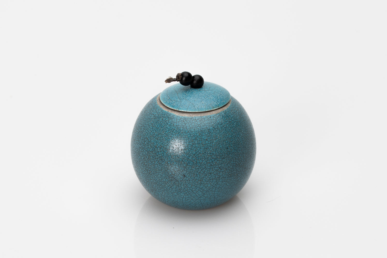 Raku Luna Sphere pot by Kate Schuricht ceramics, available at Padstow Gallery Cornwall