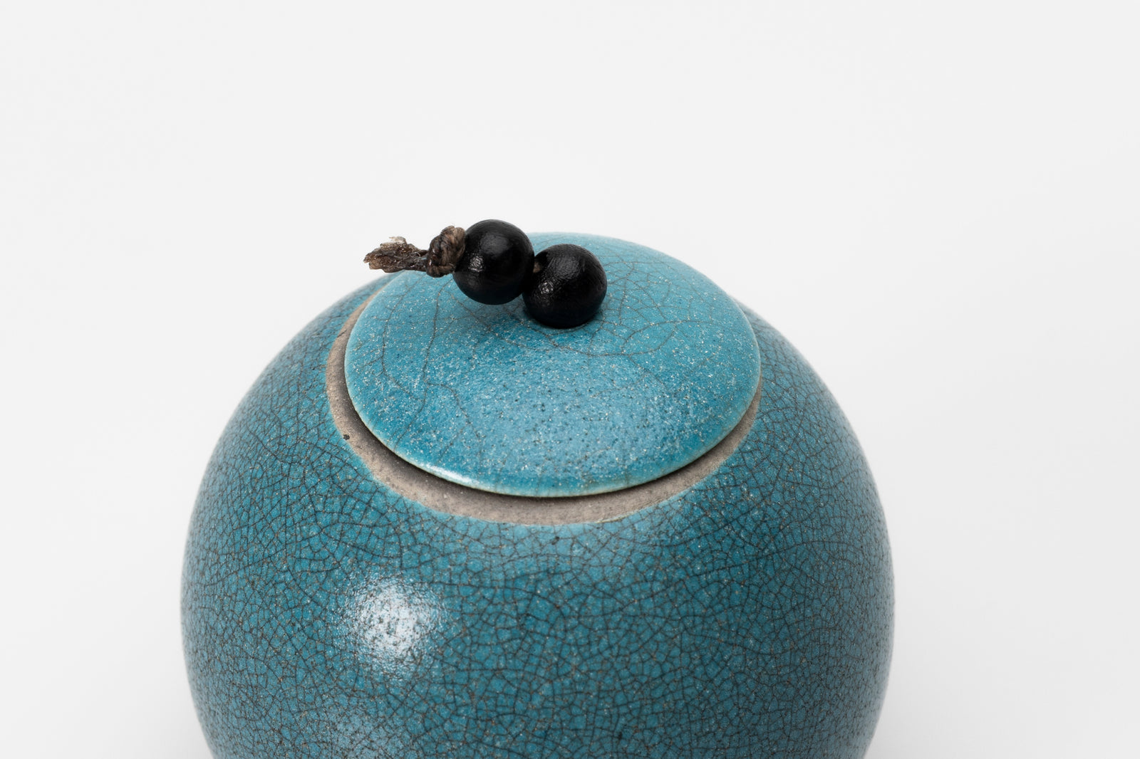 Raku Luna Sphere pot by Kate Schuricht ceramics, available at Padstow Gallery Cornwall