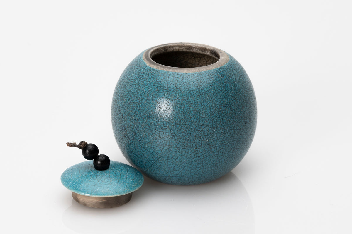 Raku Luna Sphere pot by Kate Schuricht ceramics, available at Padstow Gallery Cornwall