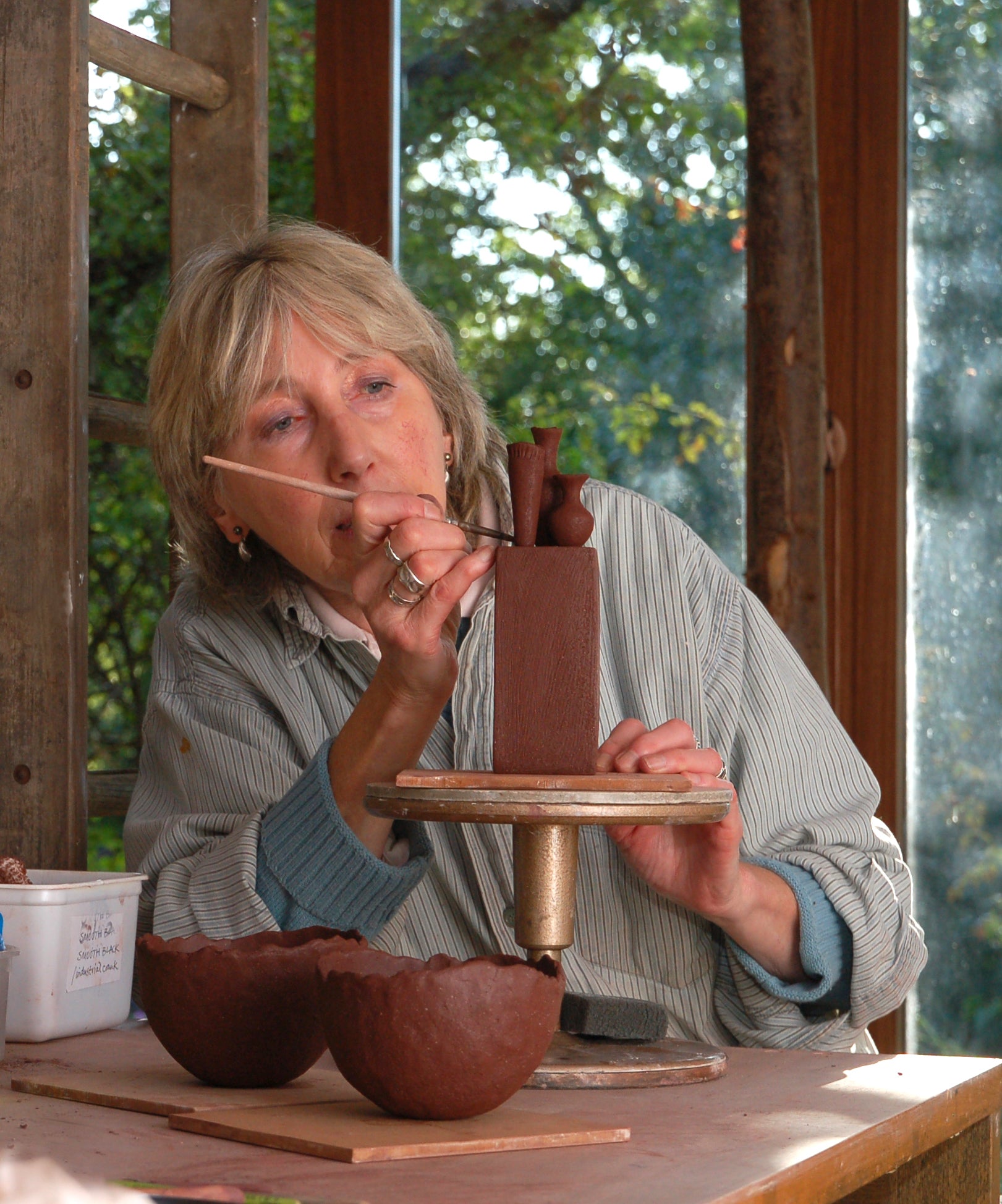 Jane Silk, ceramicist, at work in her studio