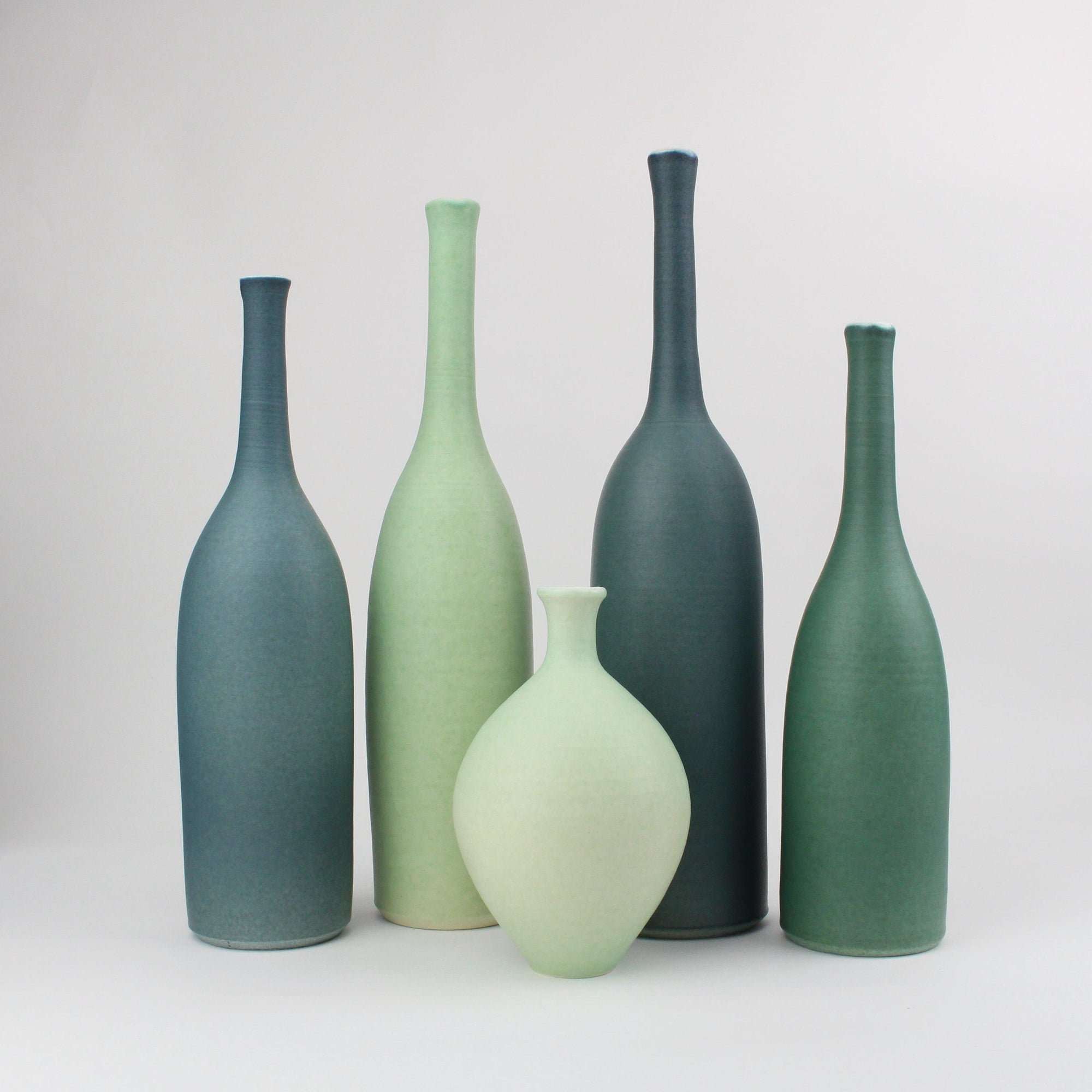 Greens and Teals set of bottles by Lucy Burley ceramics, available at Padstow Gallery, Cornwall