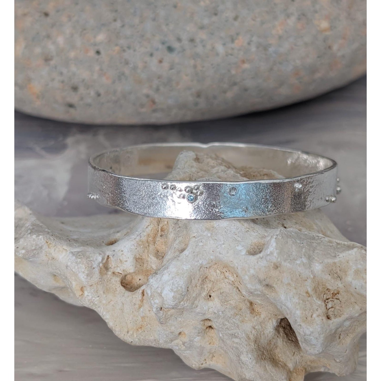 SA B39 Organic Silver Bangle with London Blue Topaz by Sandra Austin jewellery, available at Padstow Gallery, Cornwall