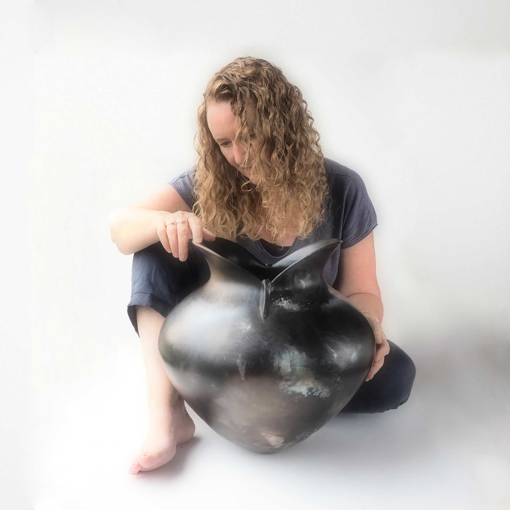 Bridget Johnson with her coil built smoke fired vessel, exclusive work available through Padstow Gallery, Cornwall