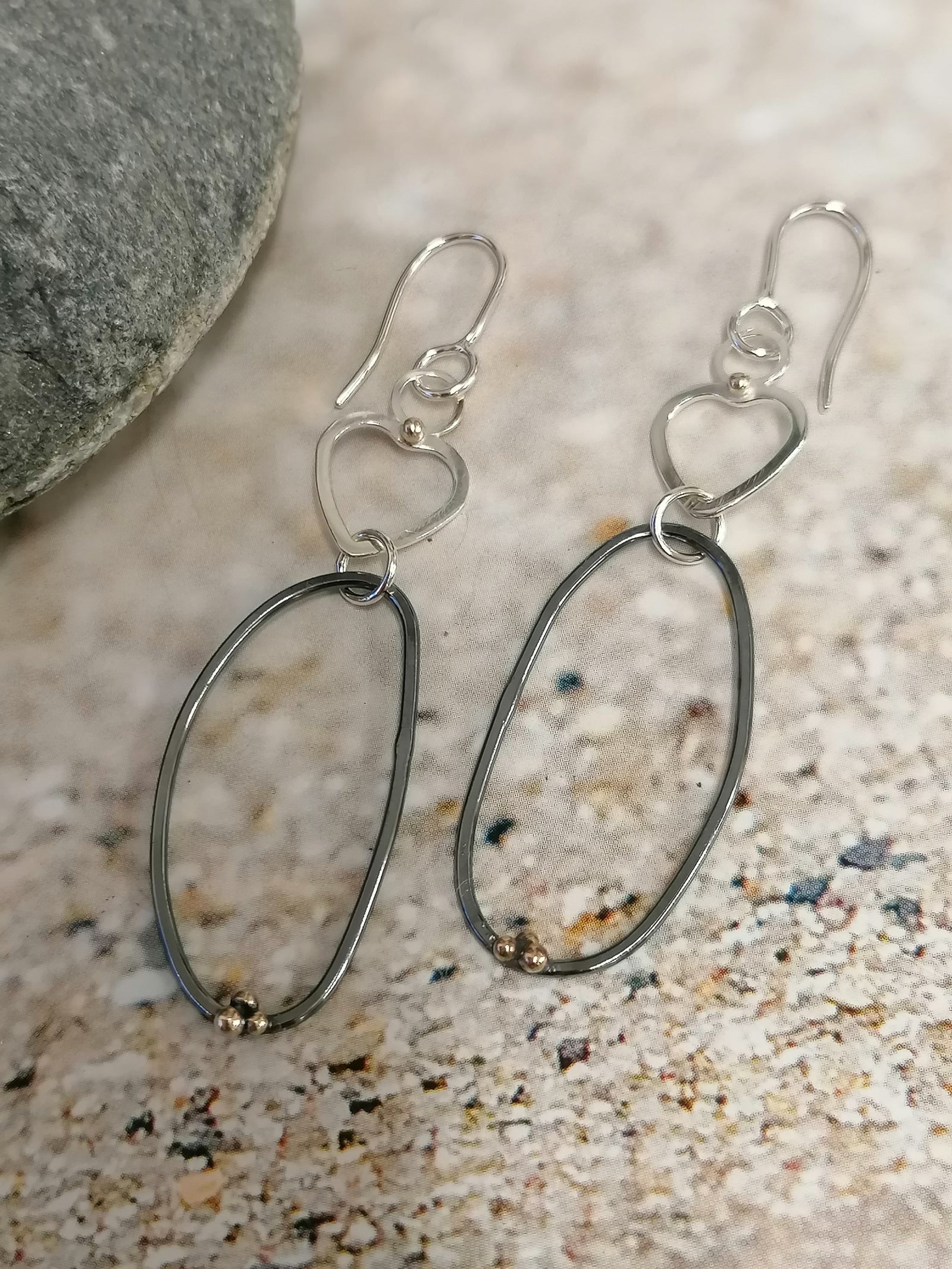 ''SA EA96 Silver heart drop earrings, large oxidised hoops and gold granules' by Sandra Austin jewellery, available at Padstow Gallery, Cornwall