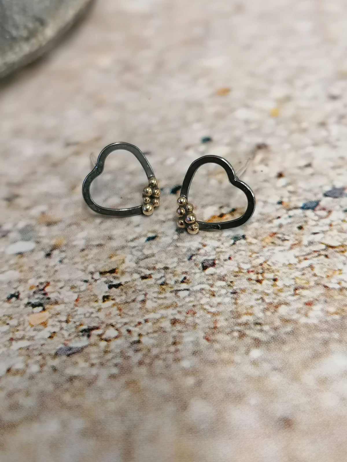 &#39;SA Ea48 oxidised heart studs with gold granules&#39; by Sandra Austin jewellery, available at Padstow Gallery, Cornwall