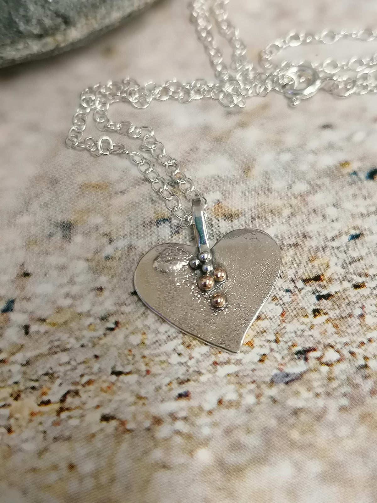 &#39;SA N31  Silver heart necklace with 9ct gold granules&#39; by Sandra Austin jewellery, available at Padstow Gallery, Cornwall