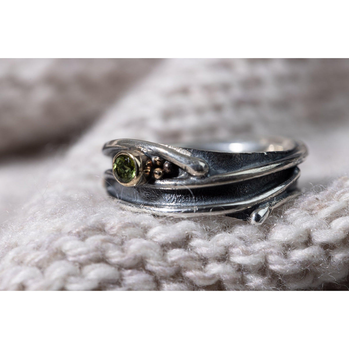 &#39;LG66 - Silver Ring with 9ct Gold 3.5mm Peridot Ring &#39; by Les Grimshaw, available at Padstow Gallery, Cornwall