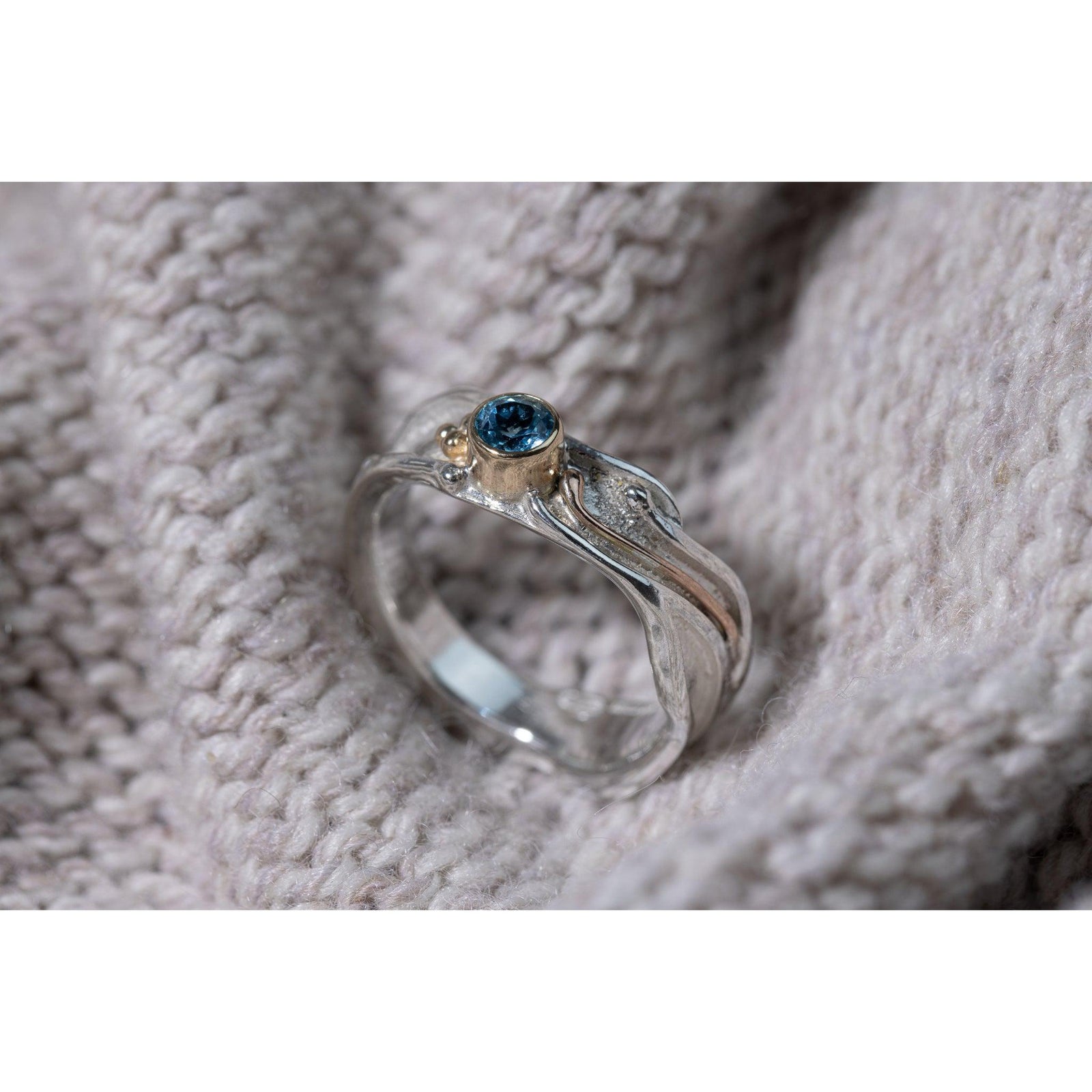 'LG64 - Silver Ring with 9ct Gold 4mm Swiss Blue Topaz Ring ' by Les Grimshaw, available at Padstow Gallery, Cornwall
